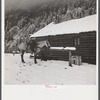 Ranch house after early fall blizzard in mountains near Aspen, Colorado.