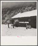 Ranch house after early fall blizzard in mountains near Aspen, Colorado.