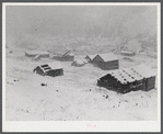 Independence, Colorado. Ghost mining town during early blizzard.
