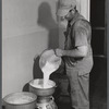 Don Shinaut, in charge of dairy enterprise, pouring milk into cans at Two River Non-Stock Cooperative, Waterloo, Nebraska. This is a FSA (Farm Security Administration) coop (see 59454-D).