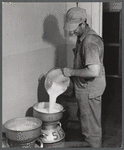 Don Shinaut, in charge of dairy enterprise, pouring milk into cans at Two River Non-Stock Cooperative, Waterloo, Nebraska. This is a FSA (Farm Security Administration) coop (see 59454-D).