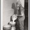 Don Shinaut, in charge of dairy enterprise, pouring milk into cans at Two River Non-Stock Cooperative, Waterloo, Nebraska. This is a FSA (Farm Security Administration) coop (see 59454-D).