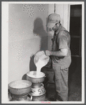 Don Shinaut, in charge of dairy enterprise, pouring milk into cans at Two River Non-Stock Cooperative, Waterloo, Nebraska. This is a FSA (Farm Security Administration) coop (see 59454-D).