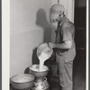 Don Shinaut, in charge of dairy enterprise, pouring milk into cans at Two River Non-Stock Cooperative, Waterloo, Nebraska. This is a FSA (Farm Security Administration) coop (see 59454-D).