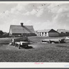 Barn and feeding pens and troughs on Tom Reed farm. Lexington, Nebraska.