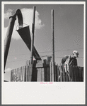 Co-op members filling a home-made silo with corn. Two Rivers Non-Stock Cooperative Company. Waterloo, Nebraska.