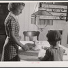 Two of the Reitz children putting the finishing touches on "lamb cake" made by Mrs. Reitz for sale at the Tri County Farmers Co-op Market, at Du Bois, Pennsylvania. On the Reitz farm near Falls Creek, Pennsylvania.
