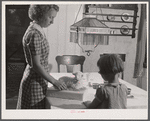 Two of the Reitz children putting the finishing touches on "lamb cake" made by Mrs. Reitz for sale at the Tri County Farmers Co-op Market, at Du Bois, Pennsylvania. On the Reitz farm near Falls Creek, Pennsylvania.