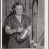 Mrs. Woods, member of board of directors of Tri-County Farmers Co-op Market at Du Bois, Pennsylvania. Wrapping buns at the market.