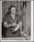 Mrs. Woods, member of board of directors of Tri-County Farmers Co-op Market at Du Bois, Pennsylvania. Wrapping buns at the market.