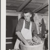 Mrs. Woods, member of board of directors of Tri-County Farmers Co-op Market at Du Bois, Pennsylvania. Wrapping buns at the market.