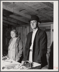 Farmer and his wife at their booth in the Tri-County Farmers Co-op Market at Du Bois, Pennsylvania.