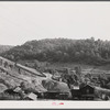 Slagpiles and houses at Coal Hollow, Pennsylvania, about twelve miles south of Saint Mary's, Pennsylvania.