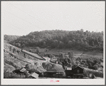 Slagpiles and houses at Coal Hollow, Pennsylvania, about twelve miles south of Saint Mary's, Pennsylvania.