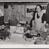 Mrs. Ralph Reitz by her booth at the Tri-County Farmers Co-op market at Du Bois, Pennsylvania.