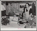 Mrs. Ralph Reitz by her booth at the Tri-County Farmers Co-op market at Du Bois, Pennsylvania.