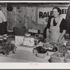 Mrs. Ralph Reitz by her booth at the Tri-County Farmers Co-op market at Du Bois, Pennsylvania.