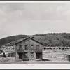 House in near-deserted town of Tyler, Pennsylvania, showing abandoned coke ovens in background.