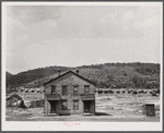 House in near-deserted town of Tyler, Pennsylvania, showing abandoned coke ovens in background.