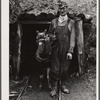Mr. Merritt Bundy of Tri-County Farmers Co-op Market at Du Bois, Pennsylvania, at the entrance to his mine on his farm near Penfield, Pennsylvania.