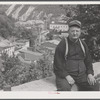 Mr. John Yenser on High Street with view of Mauch Chunk, Pennsylvania.