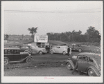 Customers' cars parked in front of Tri-County Farmers Co-op Market in Du Bois, Pennsylvania.