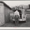 Mr. Ralph Reitz unloading produce outside of Tri-County Farmers Market in Du Bois, Pennsylvania. Produce to be sold at market.