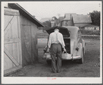 Mr. Ralph Reitz unloading produce outside of Tri-County Farmers Market in Du Bois, Pennsylvania. Produce to be sold at market.