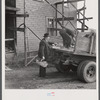 Mr. Kness, on his farm near Penfield, Pennsylvania, loading produce for sale at the Tri-County Farmers Co-op Market in Du Bois, Pennsylvania.
