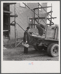 Mr. Kness, on his farm near Penfield, Pennsylvania, loading produce for sale at the Tri-County Farmers Co-op Market in Du Bois, Pennsylvania.