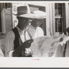 Florida migrants studying road map before leaving Elizabeth City, North Carolina for the state of Delaware.