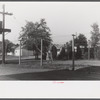 Barbed wire-enclosed barracks for migratory labors at Webster Canning Company, Cheriton, Virginia.