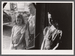 Two of the Dumond children at the back door of their home in Lille, Maine. French-Canadian potato farmers and FSA (Farm Security Administration) clients.