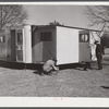 Palace mobile home. Expansion trailer for emergency defense housing demonstrated in Washington tourist camp. Washington, D.C..