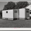 Palace mobile home. Expansion trailer for emergency defense housing demonstrated in Washington tourist camp. Washington, D.C..