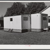 Palace mobile home. Expansion trailer for emergency defense housing demonstrated in Washington tourist camp. Washington, D.C..