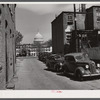Temple Court off D Street and Delaware Avenue, S.W. Washington, D.C. Negro slum area with Capitol in background.