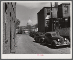 Temple Court off D Street and Delaware Avenue, S.W. Washington, D.C. Negro slum area with Capitol in background.