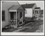 Fred B. Williams from Savannah, Georgia, a safety engineer at the powder plant, leaving his home at 803 9th Steet. Sunset Village, Radford, Virginia. FSA (Farm Security Administration) project for defense workers.