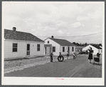Children of defense workers playing outside of their homes in Sunset Village. Radford, Virginia. FSA (Farm Security Administration) project.