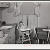 Mary K. Ratcliff, daughter of defense worker, in the kitchen of their home. Sunset Village, FSA (Farm Security Administration) project. Radford, Virginia.