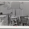 Mary K. Ratcliff, daughter of defense worker, in the kitchen of their home. Sunset Village, FSA (Farm Security Administration) project. Radford, Virginia.