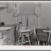 Mary K. Ratcliff, daughter of defense worker, in the kitchen of their home. Sunset Village, FSA (Farm Security Administration) project. Radford, Virginia.