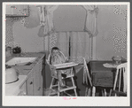 Mary K. Ratcliff, daughter of defense worker, in the kitchen of their home. Sunset Village, FSA (Farm Security Administration) project. Radford, Virginia.