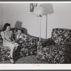 Mrs. Therman N. Ratcliff, defense worker's wife with their daughter, Mary K. Ratcliff, in their living room. Sunset Village, FSA (Farm Security Administration) project, Radford, Virginia.