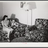 Mrs. Therman N. Ratcliff, defense worker's wife with their daughter, Mary K. Ratcliff, in their living room. Sunset Village, FSA (Farm Security Administration) project, Radford, Virginia.