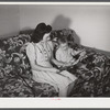 Mrs. Therman N. Ratcliff, defense worker's wife with their daughter, Mary K. Ratcliff, in their living room. Sunset Village, FSA (Farm Security Administration) project, Radford, Virginia.