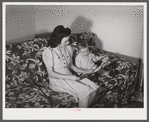 Mrs. Therman N. Ratcliff, defense worker's wife with their daughter, Mary K. Ratcliff, in their living room. Sunset Village, FSA (Farm Security Administration) project, Radford, Virginia.