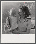 Mrs. B.M. Henderson, wife of defense worker, and daughter, who live in Sunset Village. FSA (Farm Security Administration) project. Radford, Virginia.