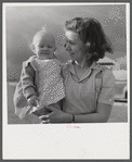 Mrs. B.M. Henderson, wife of defense worker, and daughter, who live in Sunset Village. FSA (Farm Security Administration) project. Radford, Virginia.